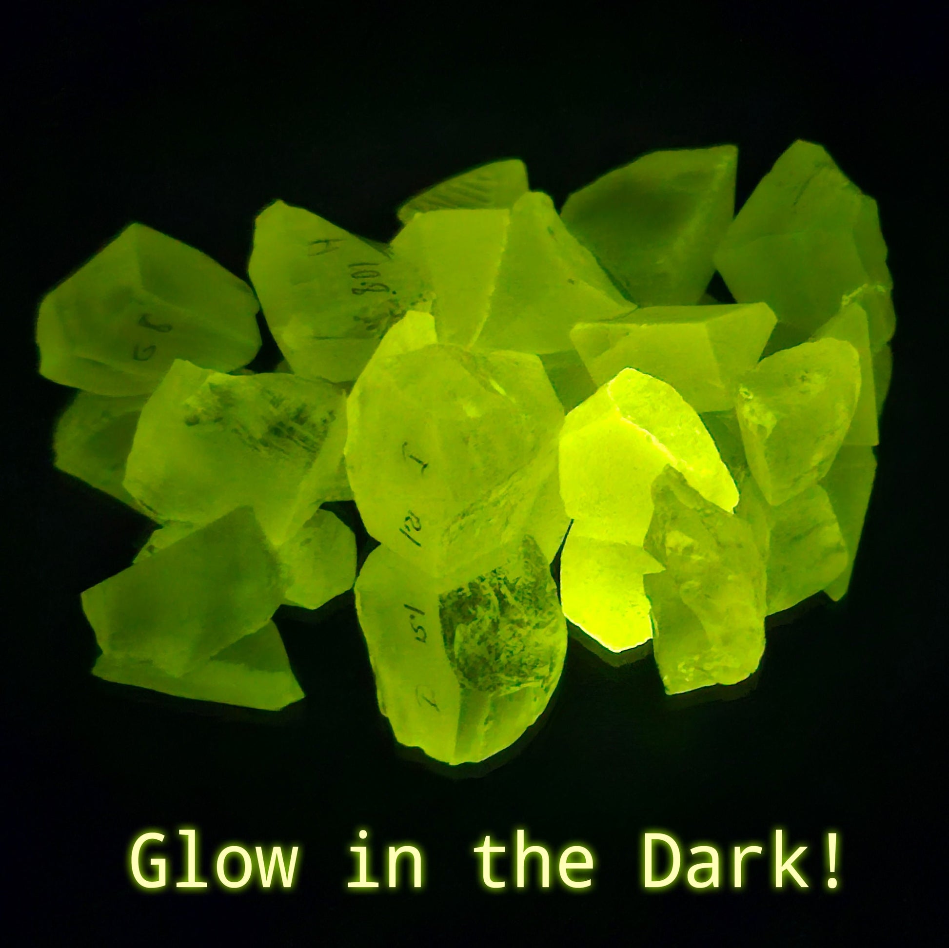 Glowing yellow phosphorescent GAGG garnet gemstones