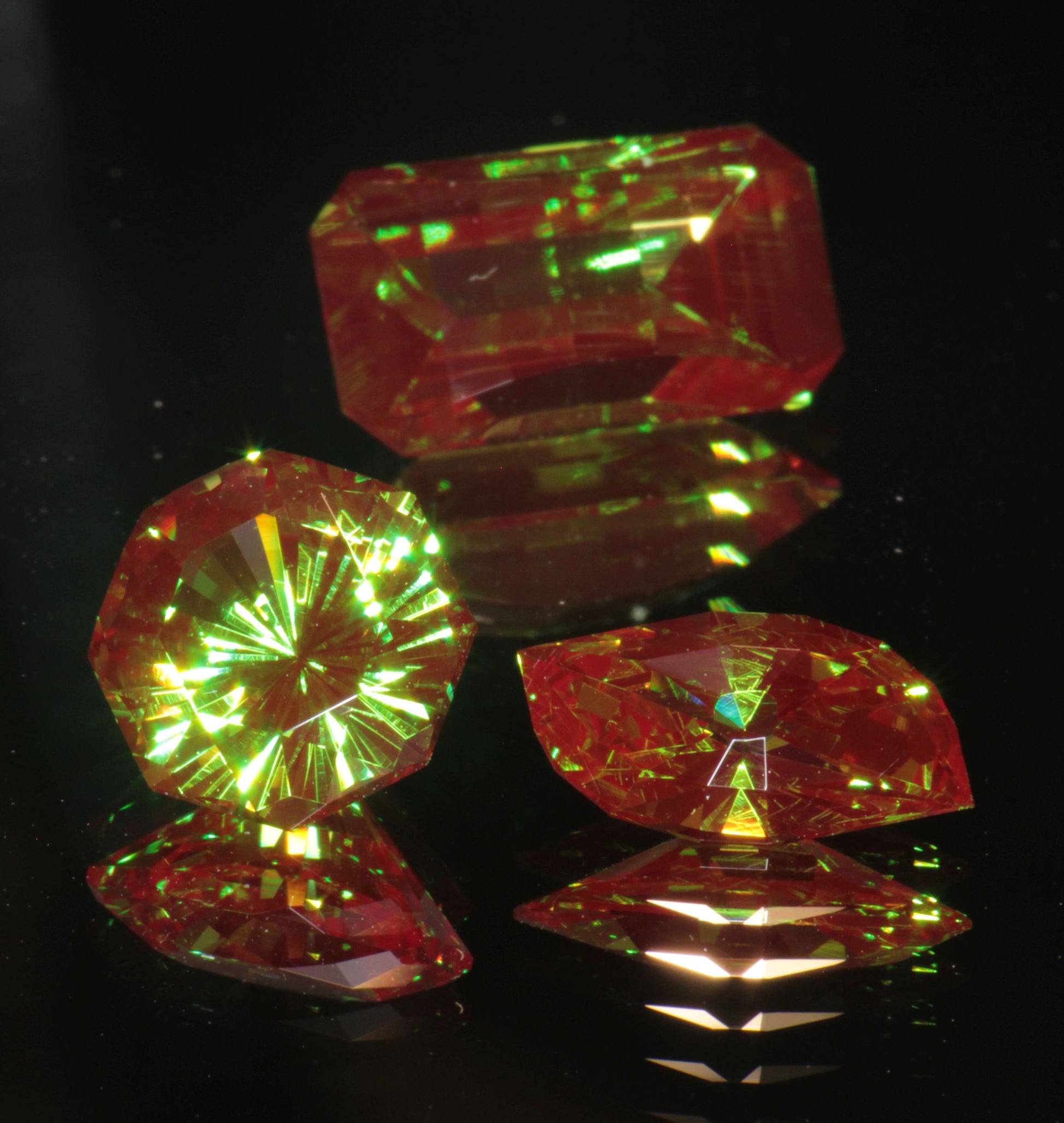 Christmas Garnets against a black background, showing red fluorescence 