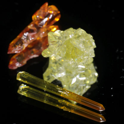 Zincite Crystals under visible light, showing orange, yellow, and red.